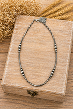 Load image into Gallery viewer, Necklace with beaded chain on a wooden box with wheat in the background