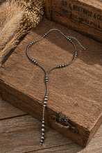 Load image into Gallery viewer, Necklace with beaded chain on a wooden surface