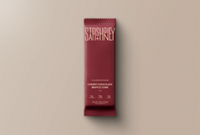 Load image into Gallery viewer, Red chocolate bar packaging with 'Stash' branding on a beige background
