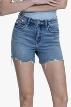 Load image into Gallery viewer, Person wearing blue denim shorts on a white background
