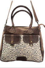 Load image into Gallery viewer, Brown handbag with patterned flap on a white background