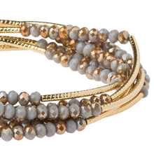 Load image into Gallery viewer, Beaded bracelet with gold accents on a white background