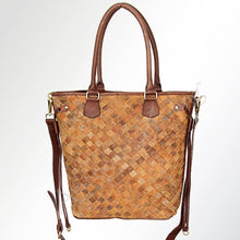 Load image into Gallery viewer, Brown woven handbag with leather accents on a light gray background