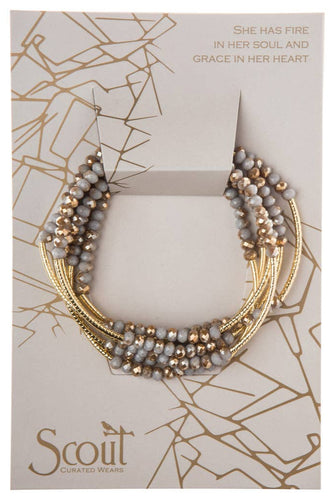Necklace on a Scout branded card with decorative design