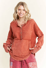 Load image into Gallery viewer, Woman wearing a rust-colored long-sleeve top with a plain background