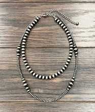 Load image into Gallery viewer, Beaded necklace on a wooden surface
