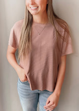 Load image into Gallery viewer, Woman wearing a pink t-shirt and light blue jeans against a neutral background