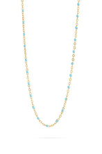 Load image into Gallery viewer, Necklace with gold chain and turquoise beads on a white background