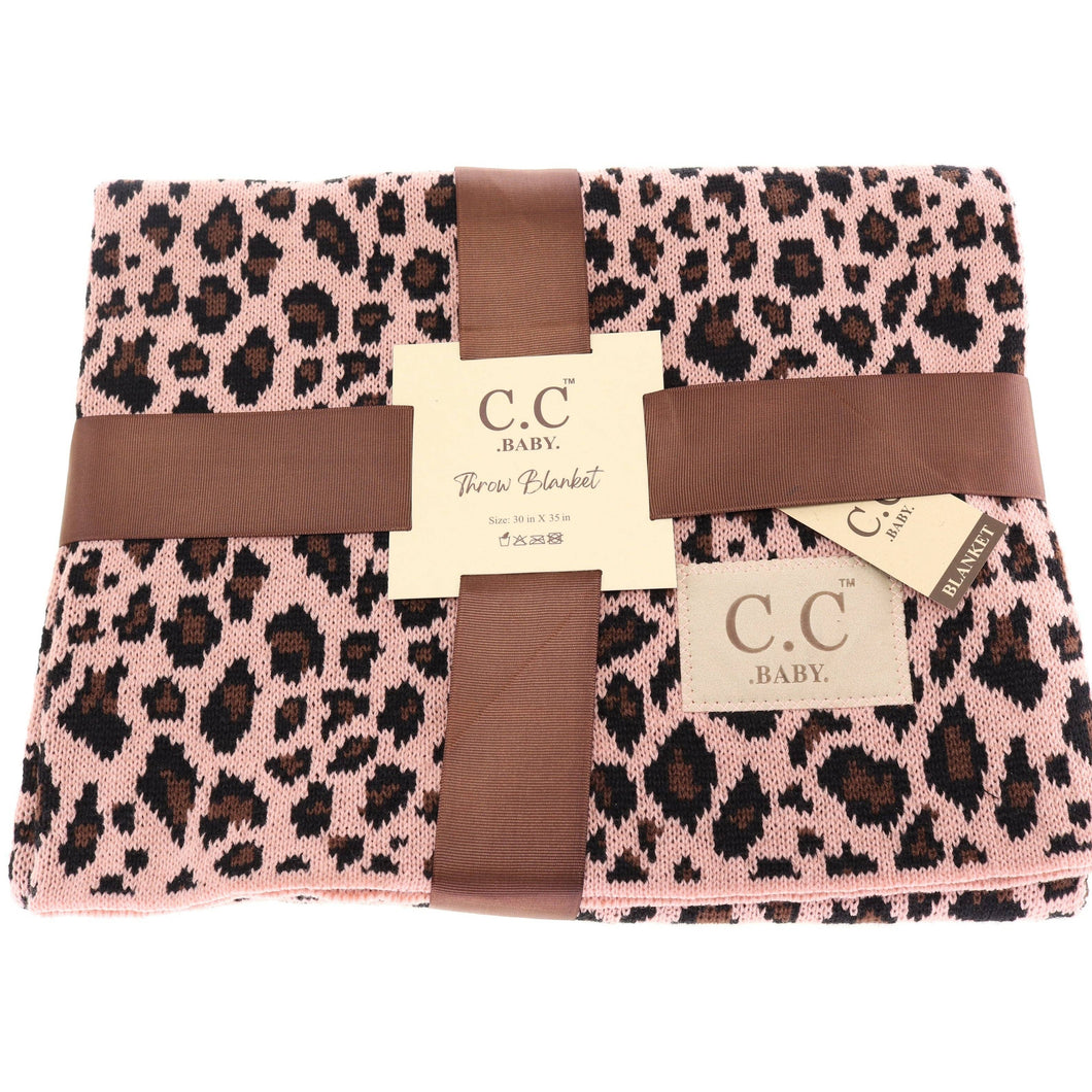 Pink leopard print blanket with brown ribbon and C.C Baby label on a white background