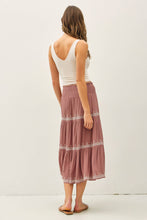 Load image into Gallery viewer, Woman wearing a white tank top and a long, patterned skirt on a plain background