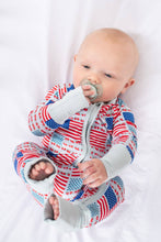 Load image into Gallery viewer, Baby wearing a red, white, and blue onesie with a pacifier in mouth on a white background