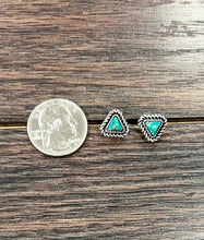 Load image into Gallery viewer, Turquoise triangle stud earrings on a wooden surface with a quarter for scale.
