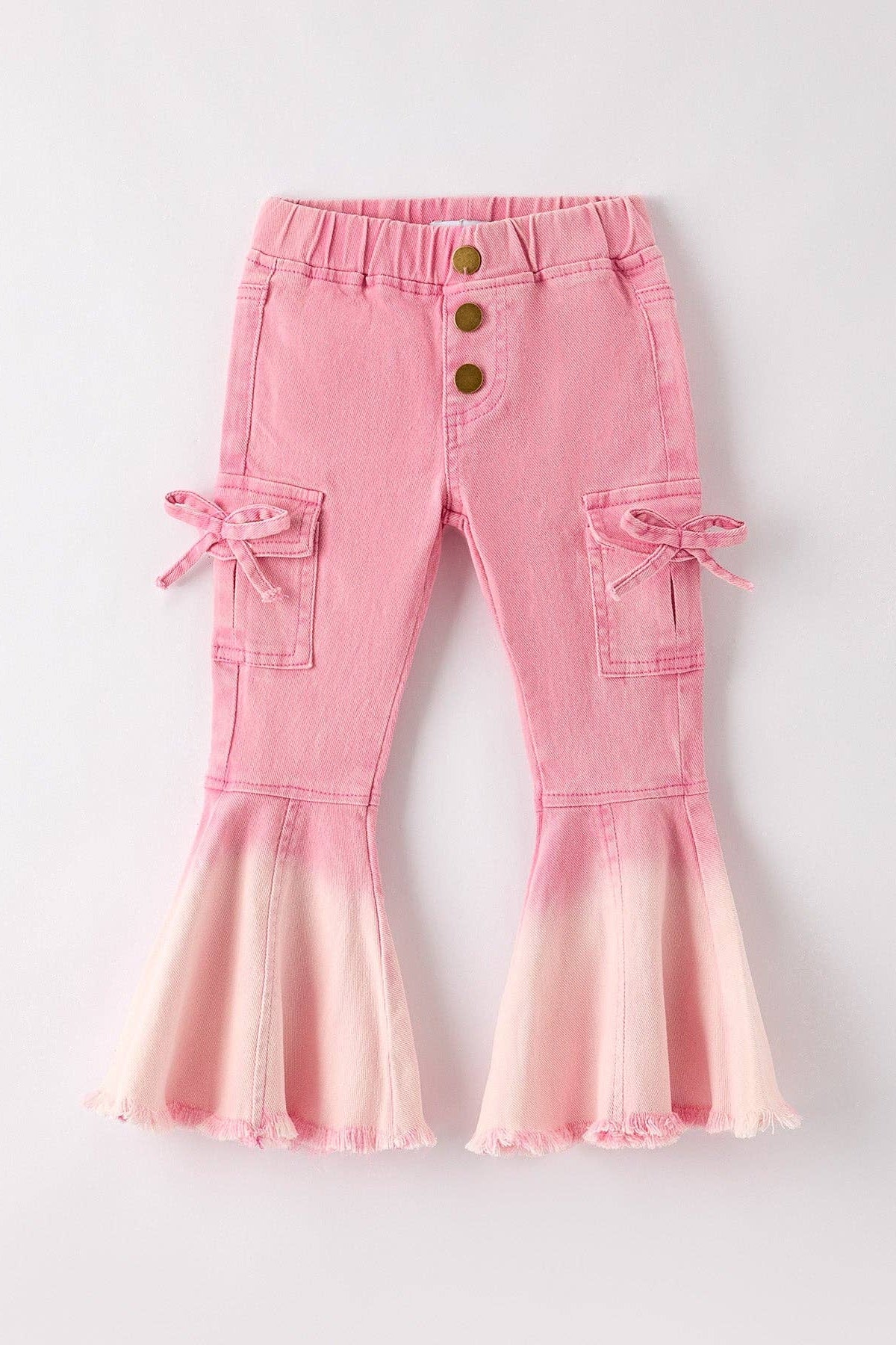 Pink flared pants with button details on a light gray background