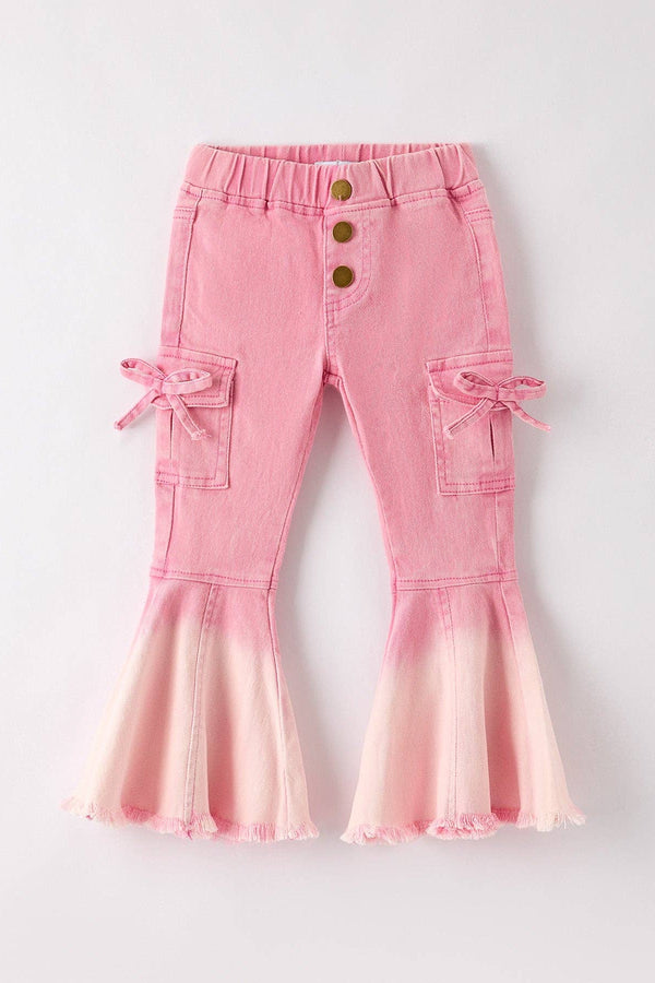 Pink flared pants with button details on a light gray background