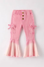 Load image into Gallery viewer, Pink flared pants with button details on a light gray background