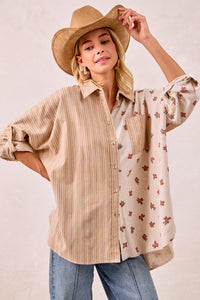 woman in button up blouse with hat on