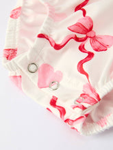 Load image into Gallery viewer, Baby diaper with pink hearts and bows on a white background