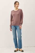 Load image into Gallery viewer, Woman wearing a mauve sweater and blue jeans against a white background