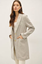 Load image into Gallery viewer, Woman wearing a light gray coat on a white background