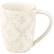 Load image into Gallery viewer, White ceramic mug with subtle leaf pattern on a white background