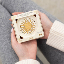 Load image into Gallery viewer, Hand holding a jewelry box with a sun design and &#39;Scout&#39; branding.