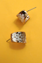 Load image into Gallery viewer, Pair of earrings with floral design on a yellow background