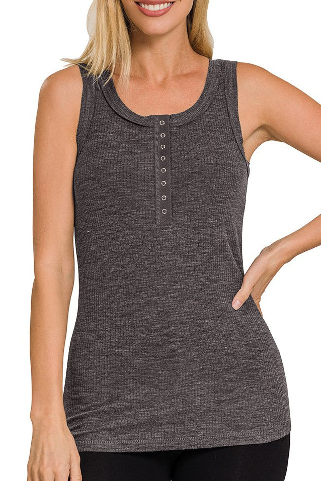 Woman wearing a charcoal ribbed tank top on a white background