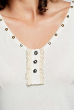 Load image into Gallery viewer, WOMAN WEARING WHITE TANK TOP WITH GREY BACKGROUND CLOSE UP