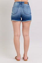 Load image into Gallery viewer, Person wearing blue denim shorts on a plain background