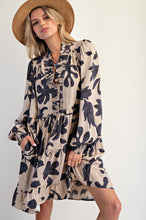 Load image into Gallery viewer, Woman wearing a floral dress and hat on a white background