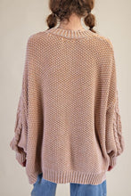 Load image into Gallery viewer, Person wearing a beige knitted sweater and blue jeans on a plain background