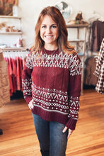 Load image into Gallery viewer, Woman wearing a patterned sweater in a clothing store