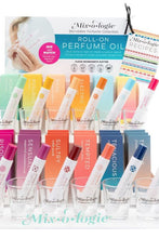 Load image into Gallery viewer, Collection of Mixologie roll-on perfume oils with packaging on a white background