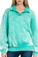 Load image into Gallery viewer, Woman wearing a turquoise fleece pullover on a white background
