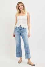 Load image into Gallery viewer, Woman wearing a white tank top and light blue jeans on a white background