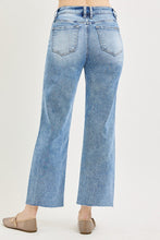 Load image into Gallery viewer, Light blue jeans worn by a person on a white background