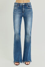 Load image into Gallery viewer, Blue flared jeans on a gray background