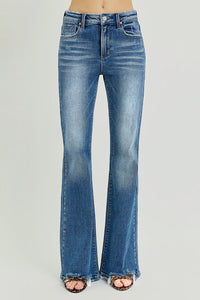 Blue flared jeans on a gray background