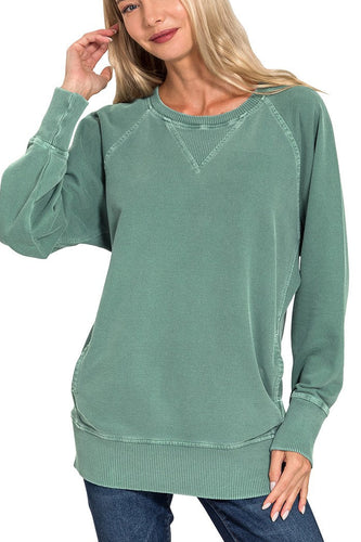 Woman wearing a green sweatshirt on a white background