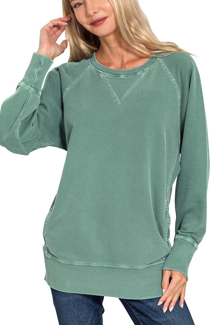 Woman wearing a green sweatshirt on a white background