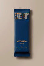 Load image into Gallery viewer, Blue protein bar packaging with 'Starshoney' branding on a beige background