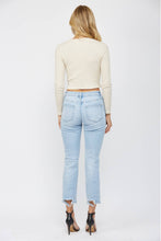 Load image into Gallery viewer, Woman wearing light blue jeans and a cream top on a white background