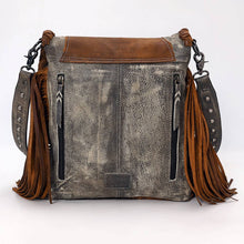 Load image into Gallery viewer, Brown leather handbag with fringes on a white background