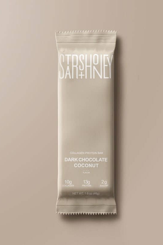 Dark chocolate coconut bar packaging on a beige background