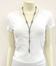 Load image into Gallery viewer, White t-shirt with a long necklace on a mannequin against a plain background