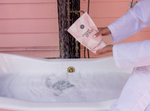 Load image into Gallery viewer, Person in a bath holding a pink book titled &#39;Sugar &amp; Spice&#39; with a blurred background.