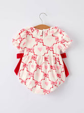 Load image into Gallery viewer, Baby romper with pink heart pattern and red accents on a white background