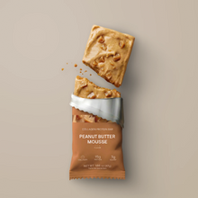 Load image into Gallery viewer, Collagen protein bar with peanut butter mousse flavor on a beige background