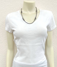 Load image into Gallery viewer, White t-shirt on a mannequin with a necklace against a light background