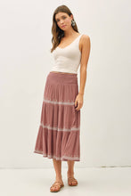 Load image into Gallery viewer, Woman wearing a white tank top and pink skirt with white embroidery on a white background